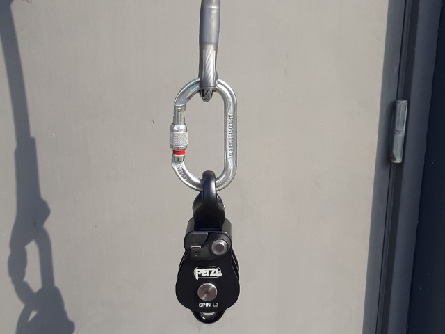 Gravity loaded karabiner.